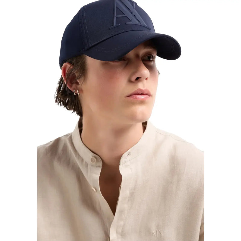 Armani Exchange men blue print polyester cap featuring a navy blue color with a subtle embossed logo on the front