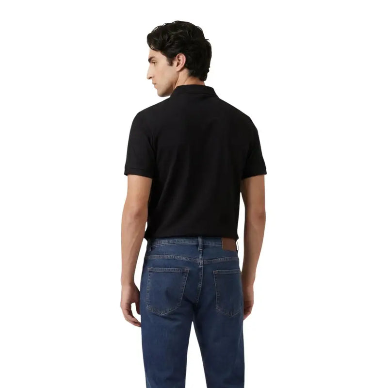 Polo noir à manches courtes pour homme, col classique et poignets côtelés. Armani Exchange en tissu viscose