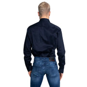 Men’s dark blue button-up shirt and blue jeans from Armani Exchange for spring summer wear