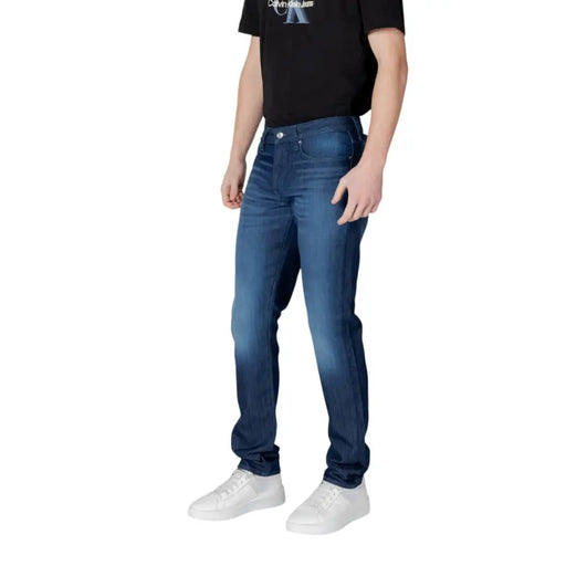 Armani Exchange men jeans in dark blue cotton stretch with slim fit and faded wash featuring classic stitching