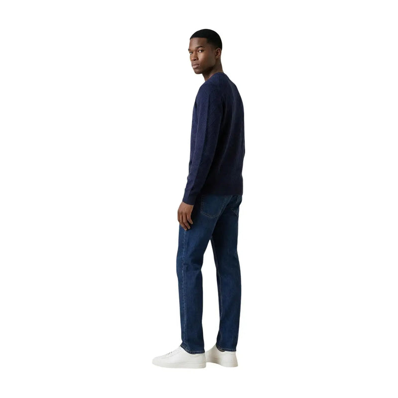 Armani Exchange men knitwear navy blue long sleeve round neck sweater made of knit fabric worn by a man