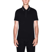 Armani Exchange Polo noir à manches courtes en coton pour homme, avec liseré blanc au col et aux poignets (vue de face).