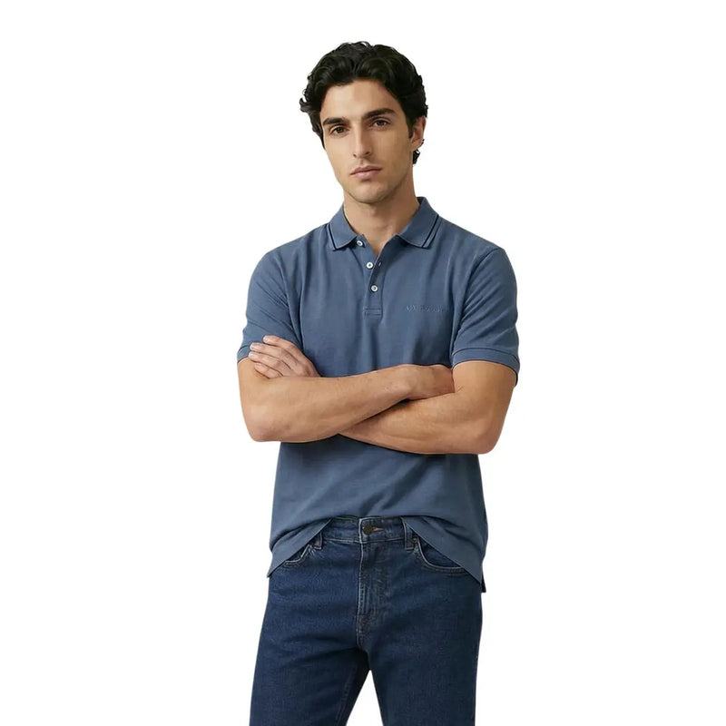 A man wearing an Armani Exchange men polo navy blue short sleeve cotton elastane shirt with embroidered logo