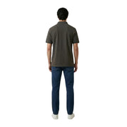 A man wearing an Armani Exchange men polo brown short sleeve cotton elastane shirt with classic collar and stitched seams