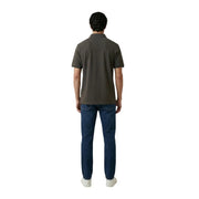 A man wearing an Armani Exchange men polo brown short sleeve cotton elastane shirt with classic collar and stitched seams