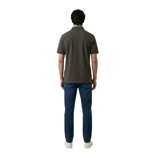 A man wearing an Armani Exchange men polo brown short sleeve cotton elastane shirt with classic collar and stitched seams