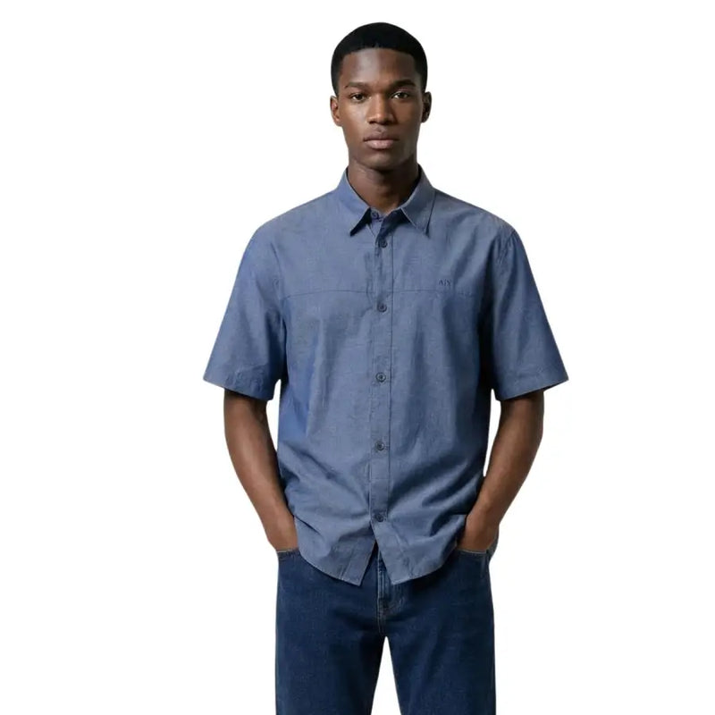 Armani Exchange men shirt in blue with short sleeves, subtle textured weave, and small embroidered chest logo
