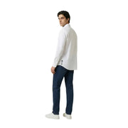 Back view of an Armani Exchange men’s white long-sleeved button-up shirt with subtle vertical logo on lower back seam