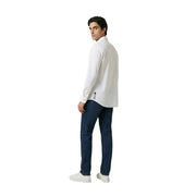 Back view of an Armani Exchange men’s white long-sleeved button-up shirt with subtle vertical logo on lower back seam