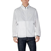 Men’s white zip-up windbreaker jacket paired with dark blue jeans from Armani Exchange