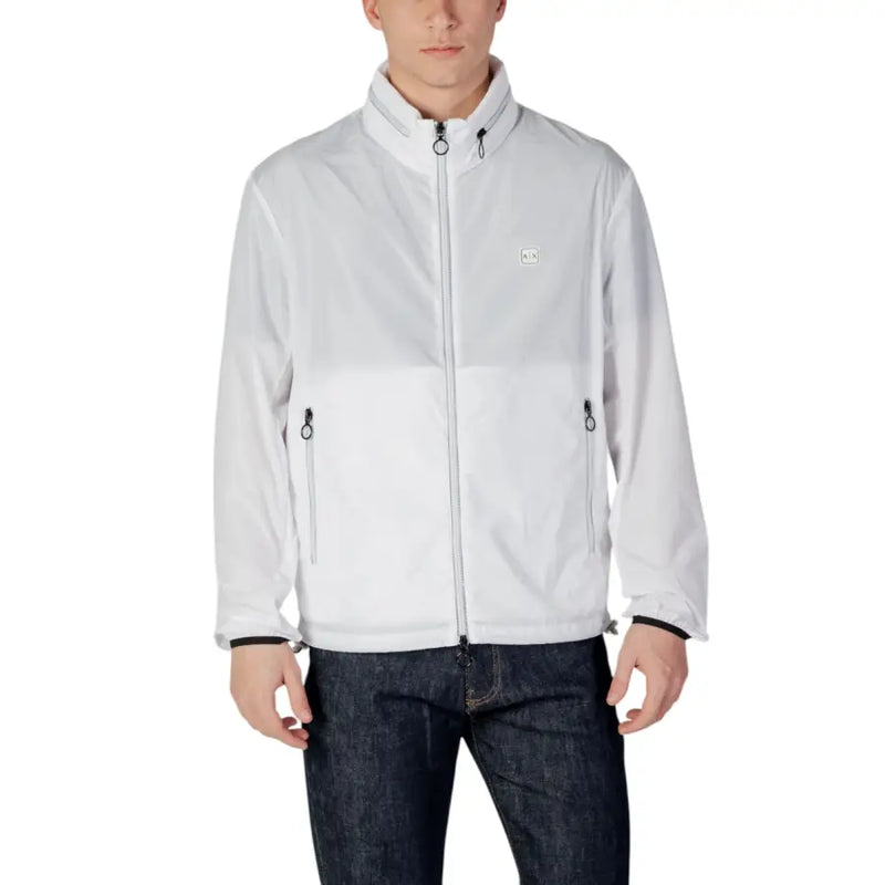 Men’s white zip-up windbreaker jacket paired with dark blue jeans from Armani Exchange