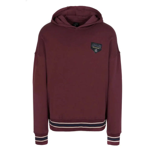Armani Exchange Herren-Sweatshirt, bordeauxrot, mit Kapuze, Tasche, schwarz-weiß gestreiften Bündchen und Logo-Aufnäher.