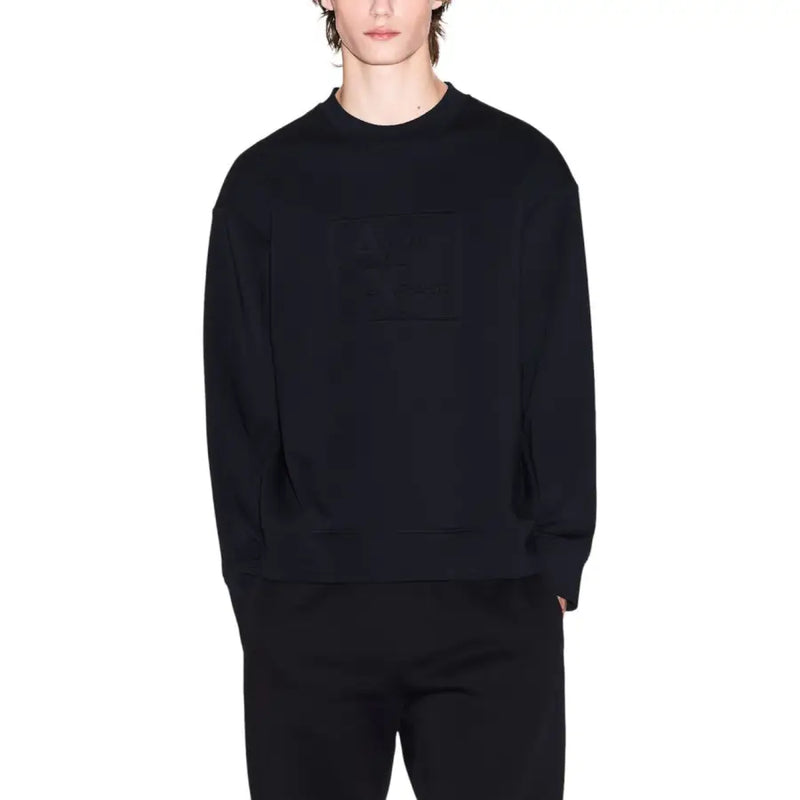 Black oversized crewneck sweatshirt by Armani Exchange with a subtle textured logo patch on the chest