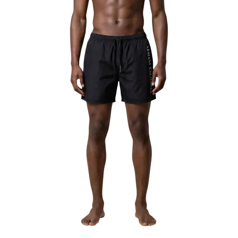 Armani Exchange men swimwear black swim trunks with subtle vertical logo on the side designed for beachwear