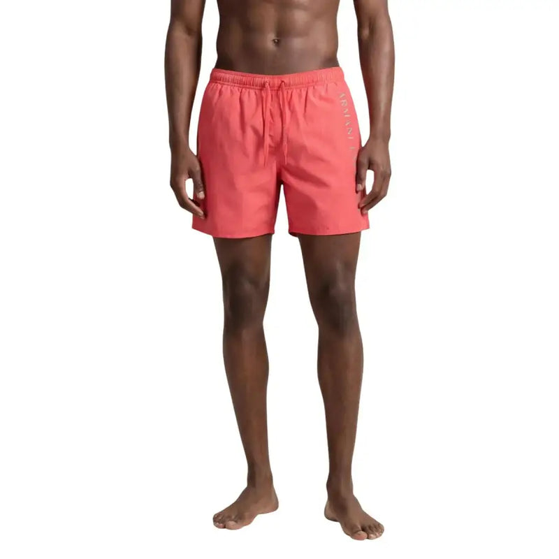 Coral-colored armani exchange men swim trunks with drawstring waistband and vertical branding on the side