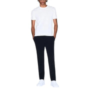 Armani Exchange men t-shirt paired with sleek black tailored trousers featuring smooth fabric and clean lines