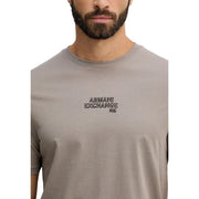 Beige Armani Exchange men t-shirt featuring black embroidered Armani Exchange N.Y. logo on the chest