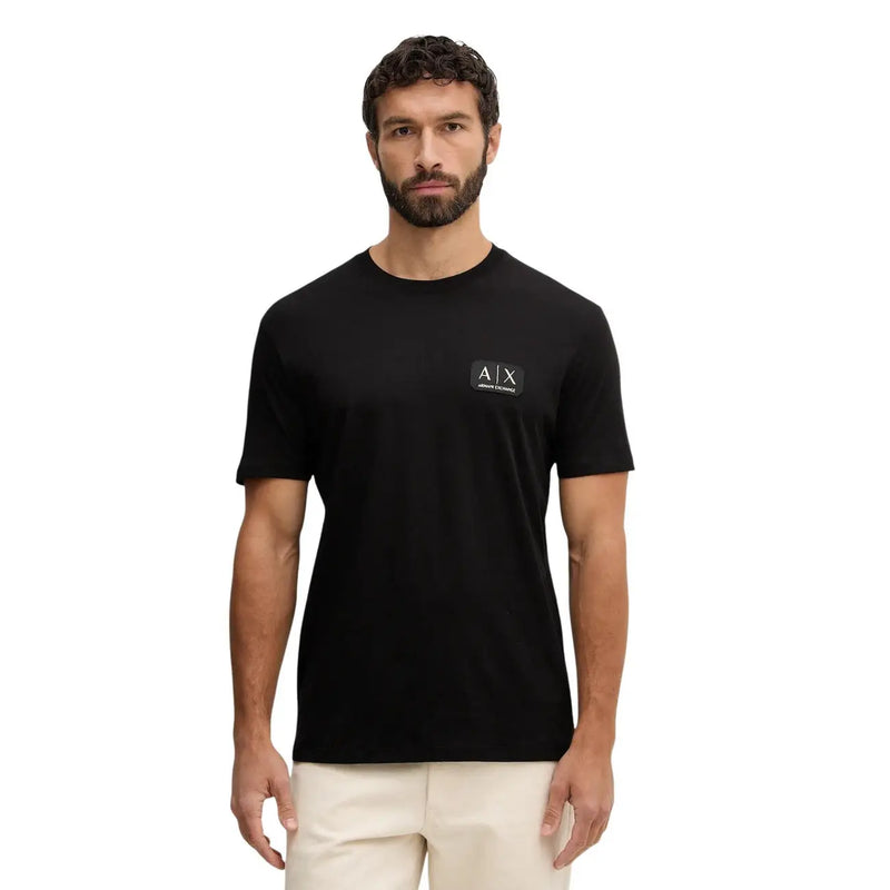 Armani Exchange men t-shirt in black short sleeve featuring a subtle white logo patch on the left chest