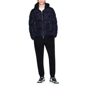 Navy blue quilted puffer jacket with front zipper closure featured in Armani Exchange men trousers product