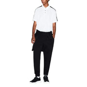 White polo shirt with black trim on collar and sleeves paired with Armani Exchange men trousers in a casual outfit