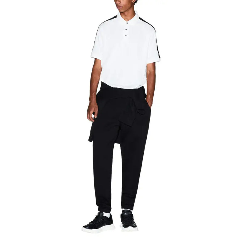 White polo shirt with black trim on collar and sleeves paired with Armani Exchange men trousers in a casual outfit