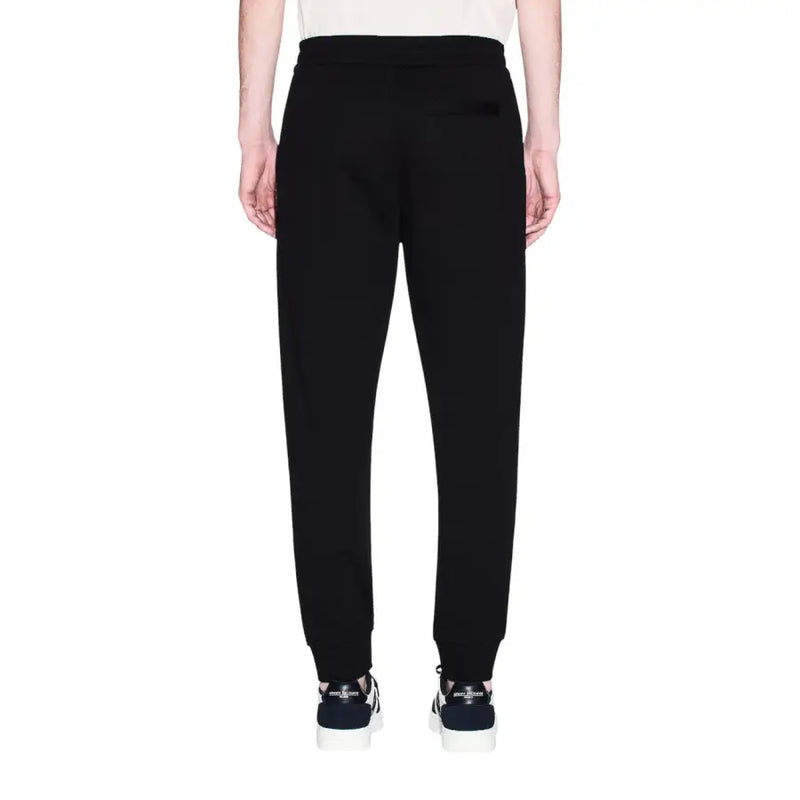 Armani Exchange men trousers black cotton joggers with tapered leg and ribbed cuffs front view