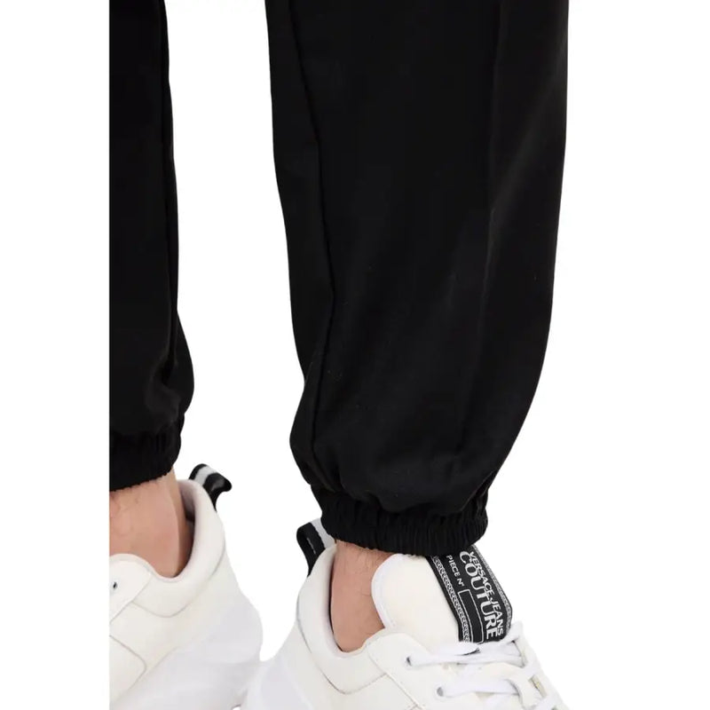 Black drawstring jogger pants with relaxed fit and elastic cuffs from Armani Exchange men trousers collection