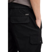 Black Armani Exchange men trousers with drawstring waistband and multiple pockets showing back side with brand tag