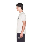 Armani Exchange men white cotton t shirt with short sleeves and black circular logo paired with navy pants embroidery