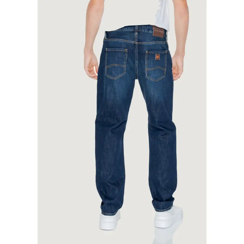 Back side of armani exchange men’s dark blue denim jeans with classic straight-leg cut and brown leather patches
