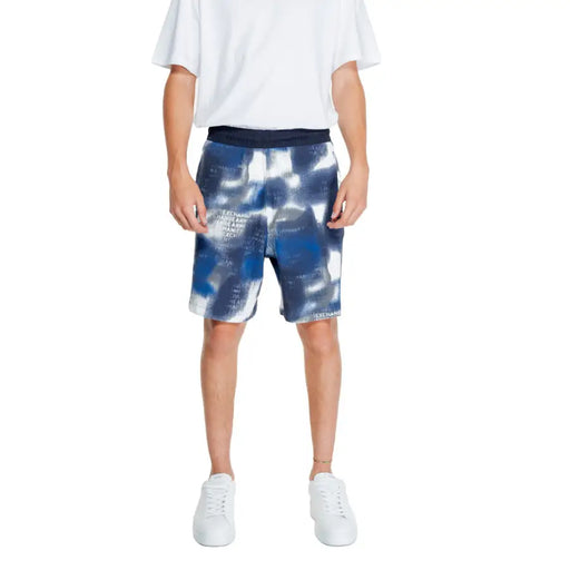 Armani Exchange men’s blue and white abstract patterned cotton-lycra blend shorts with dark navy elastic waistband
