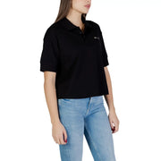 Armani Exchange women black cotton short-sleeved polo shirt with subtle white embroidered logo on left chest