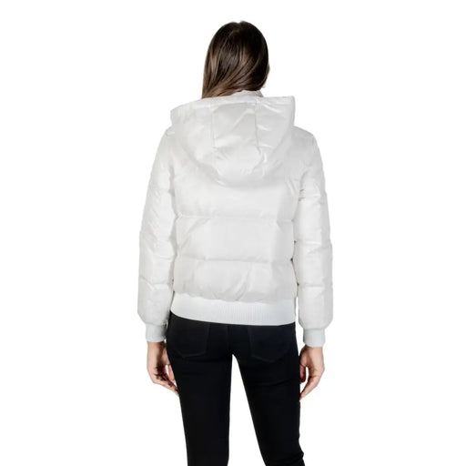 Woman wearing Armani Exchange long white hooded fall winter puffer jacket and black pants