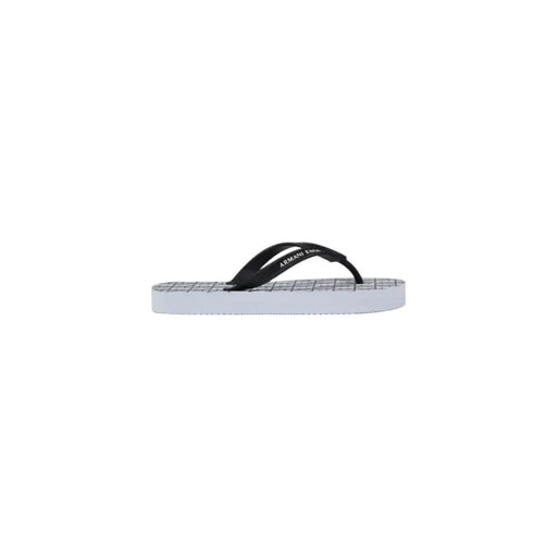 Armani Exchange women white rubber flip flops with black and white straps and a grid-patterned sole