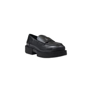 Armani Exchange women’s black leather moccasin slippers with chunky ribbed sole and metallic logo plaque on vamp