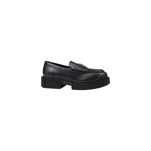 Armani Exchange women’s black leather moccasin slippers with a minimalist design and chunky ribbed sole