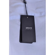 Black Armani Jeans brand tag hanging from a light blue cotton blend t shirt for men