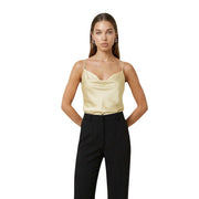 A sleek pale gold satin camisole with delicate spaghetti straps and a softly draped neckline by artigli