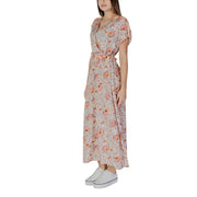 A flowing light pink floral cotton maxi dress with short flutter sleeves and self-tie waistband by B.young