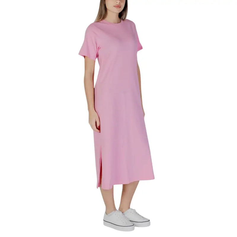 A soft pink short cotton dress by B.young with short sleeves round neckline and a side slit midi length