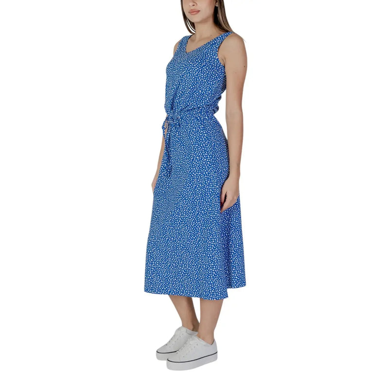 A blue sleeveless midi dress by B.young with white polka dots and a self-tie waistband