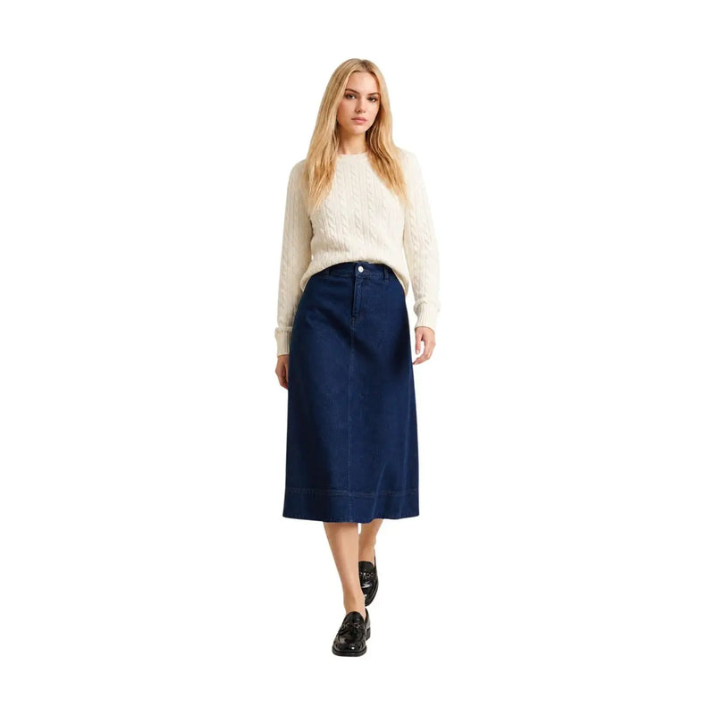 Navy blue denim midi skirt with straight cut and button closure shown alongside barbour women wool cotton white ashdown knitted jumper