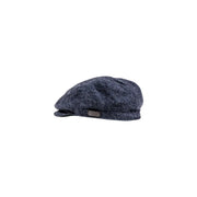 Casquette plate Barbour en laine pour homme, en tweed à chevrons bleu foncé, avec étiquette en cuir, vue de profil
