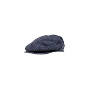 Casquette plate Barbour en laine pour homme, en tweed bleu foncé, avec surface texturée structurée et visière courte (vue de face)