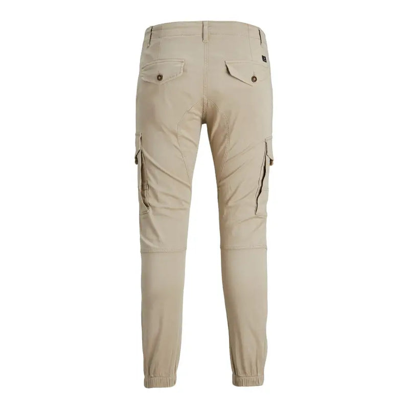 Beige cotton jack and jones mens cargo trousers with elastic cuffs and buttoned back pockets shown from the back side