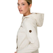 Beige hooded zip blazer for women with pockets and a brown circular patch on the sleeve in a soft fabric