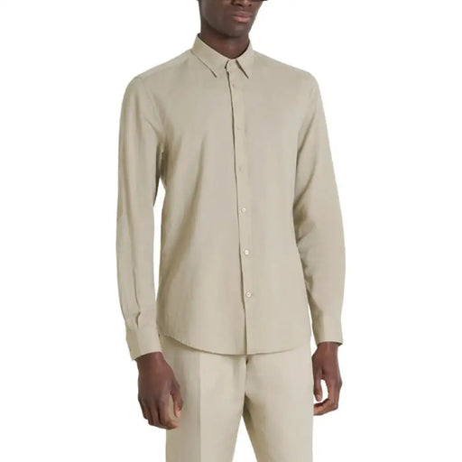 Beige long-sleeved dress shirt showcased in Beige Long Sleeved Dress Shirt and Trousers