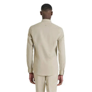 Beige long-sleeved dress shirt and trousers displayed elegantly for formal wear