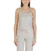 Beige sleeveless round neck polyester top for women with delicate spaghetti straps and gathered waistband in light gray