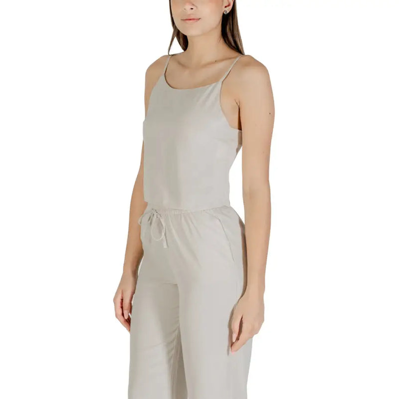 Beige sleeveless round neck polyester jumpsuit for women with thin straps and a drawstring waist